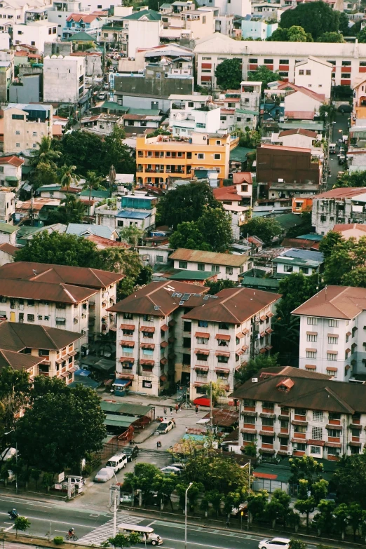 an aerial view of a residential area with many different buildings and parking areas