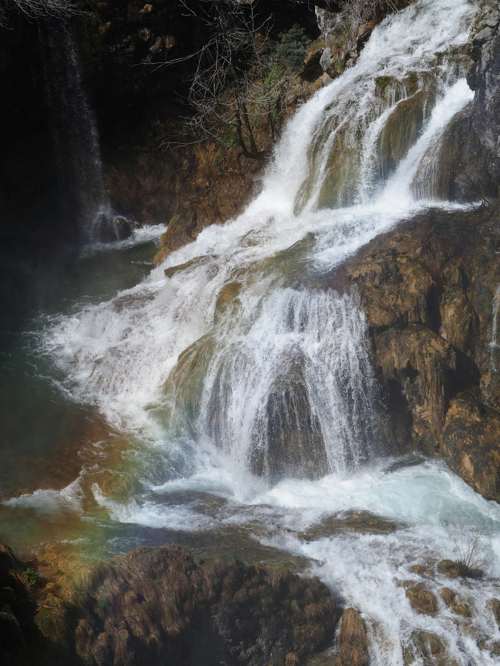 this waterfall has three smaller streams going up the side