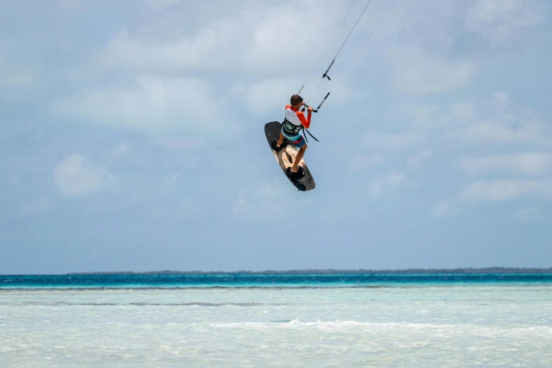 a person that is in the air with a surfboard