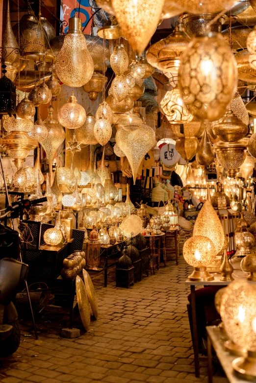 a room filled with lots of hanging lights