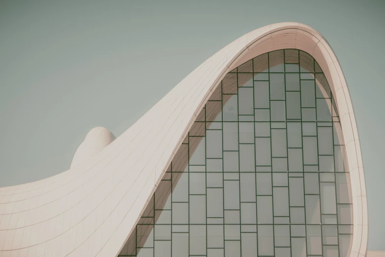 a picture taken from a moving train looking up at the architecture