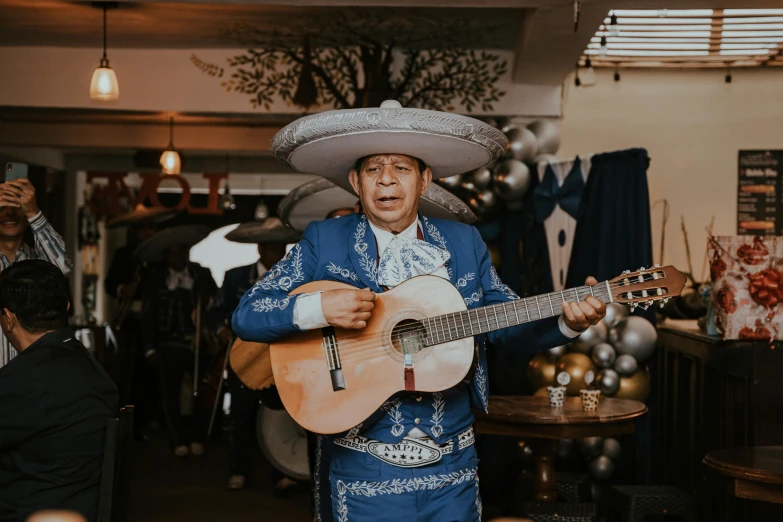 a statue of a man holding a guitar