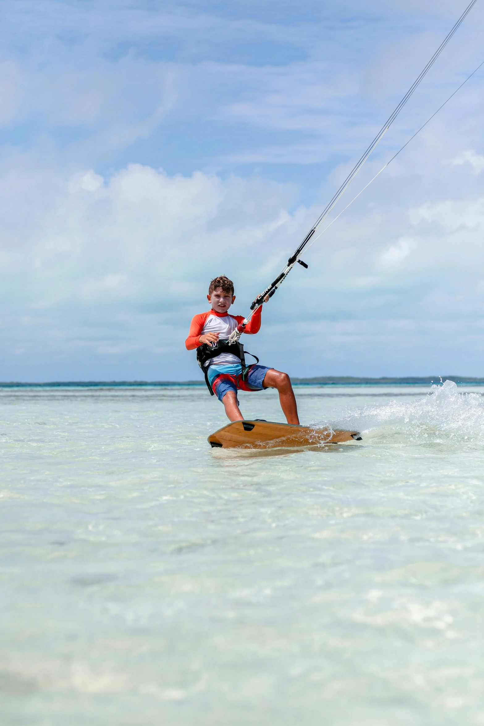 a man who is jumping on a surfboard in the water