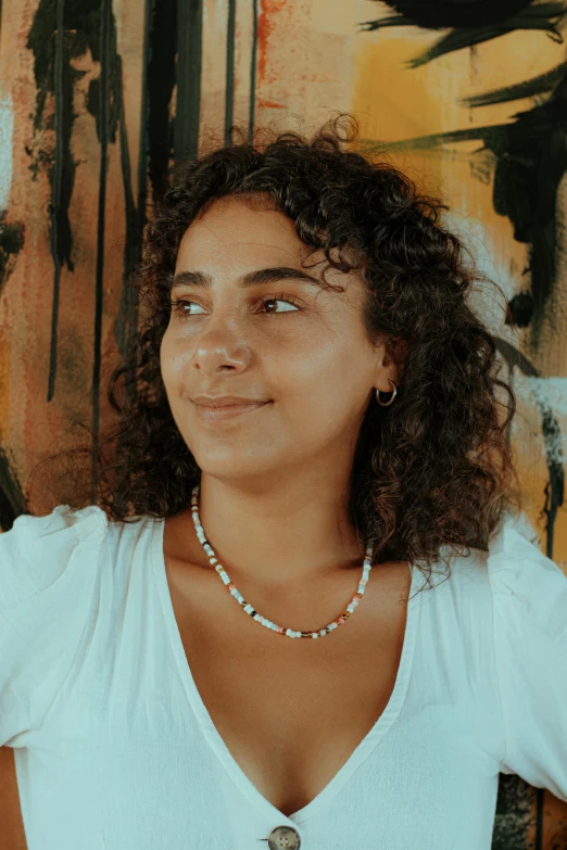 a woman posing for a picture with her shirt open