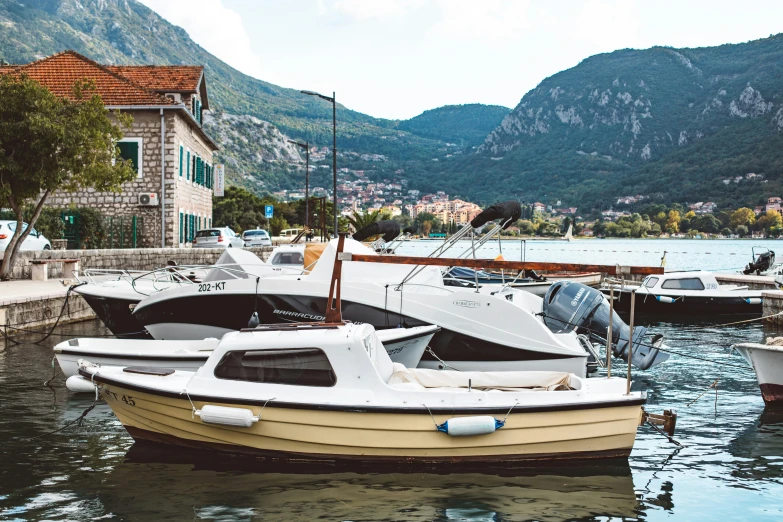 there are many boats parked by the water