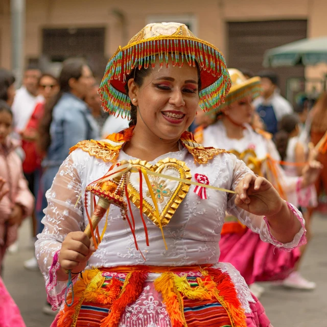 a group of women in colorful costumes with hats