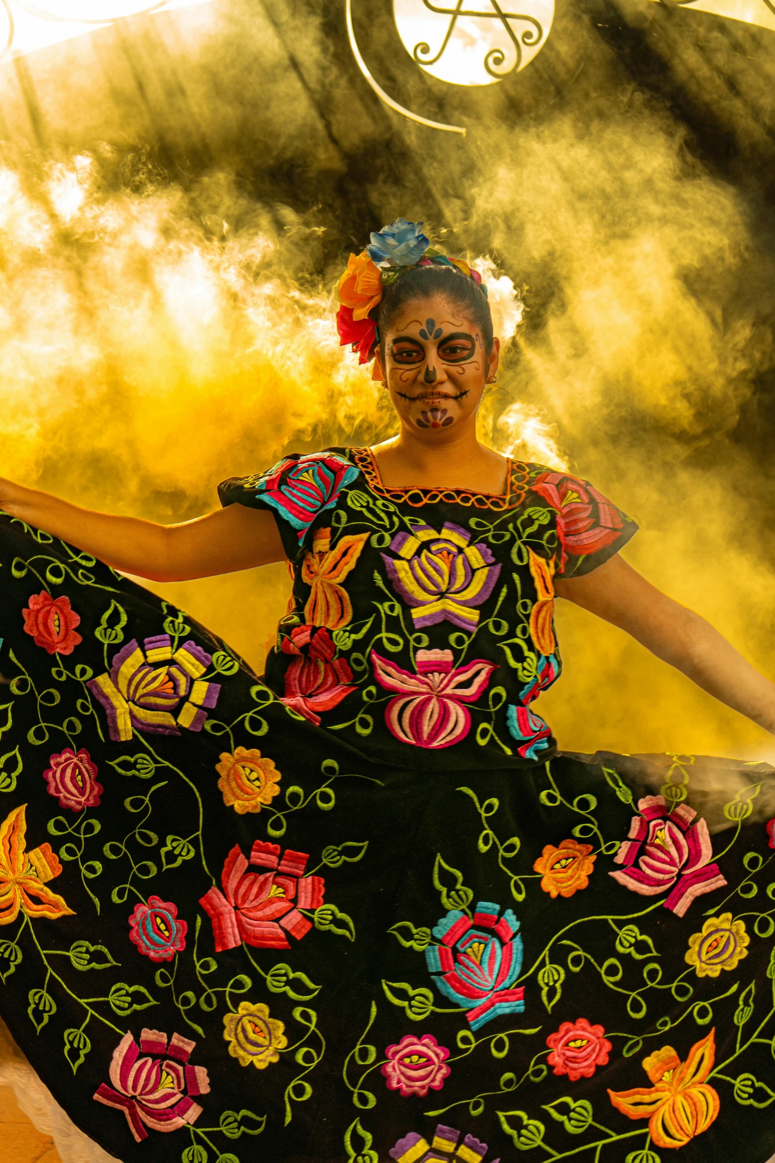 woman in brightly colored ethnic clothing performing on stage