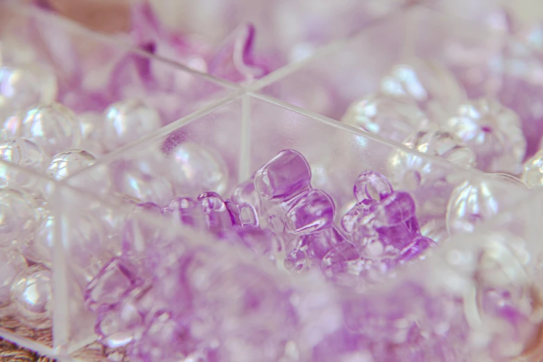 a pile of white and purple crystals with little white stars