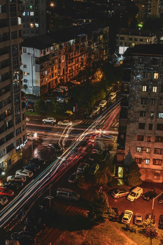 a cityscape showing multiple street lights and a busy highway