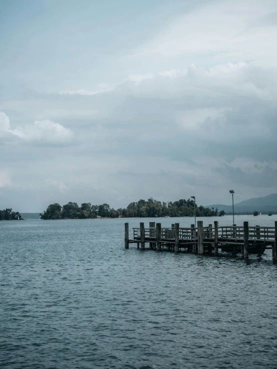 a pier and other boats in a body of water