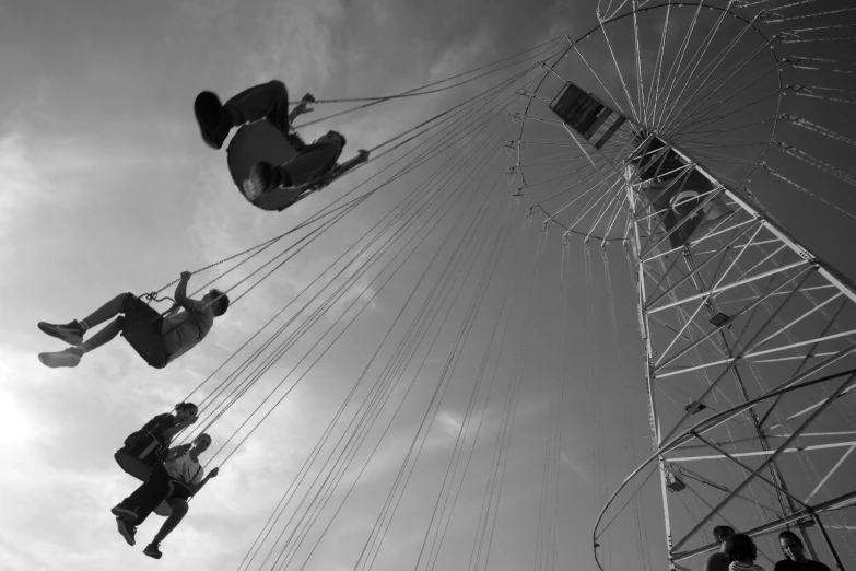 some people are on carnival rides and riding them