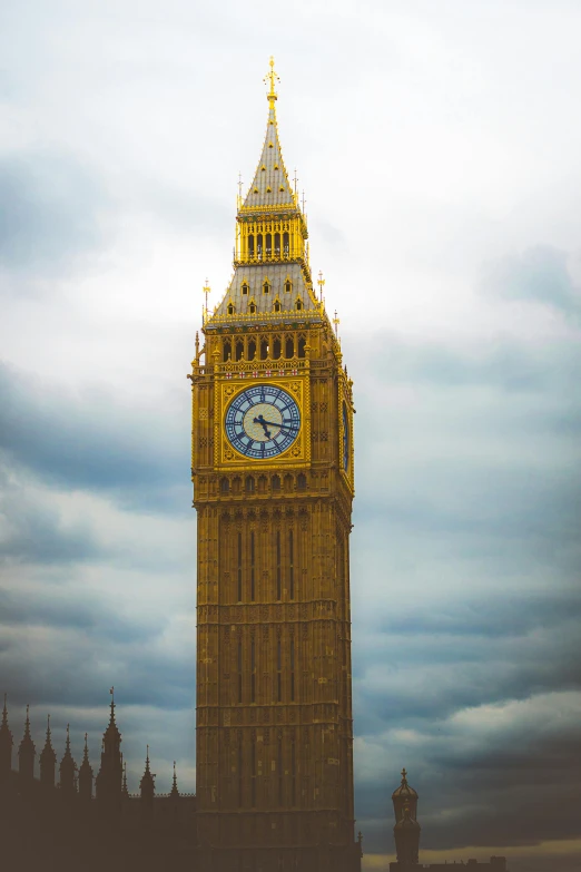 an image of a clock tower under a blue sky