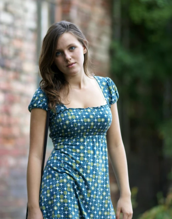 the young woman is wearing a short dress