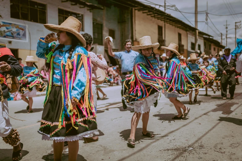 there are many people in costumes walking down the street