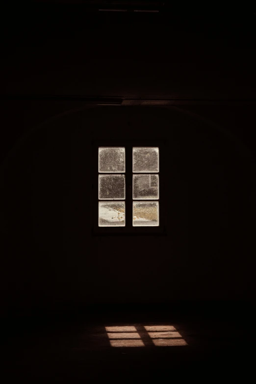 a room with several squares of windows in it