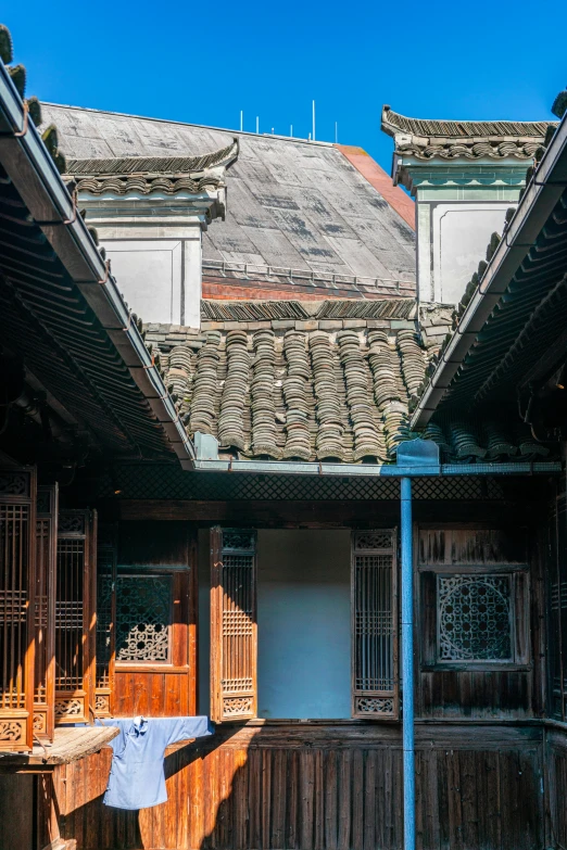 some buildings with a blue pole in front of them