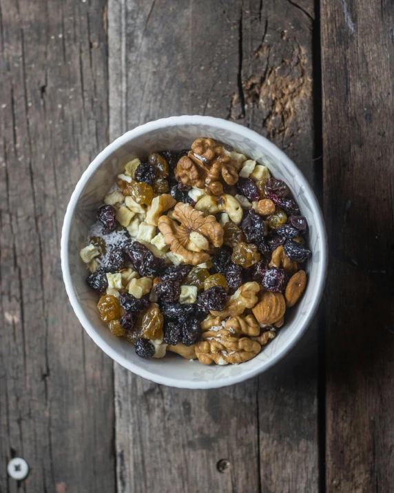 an overhead view of some food with nuts and cranberries