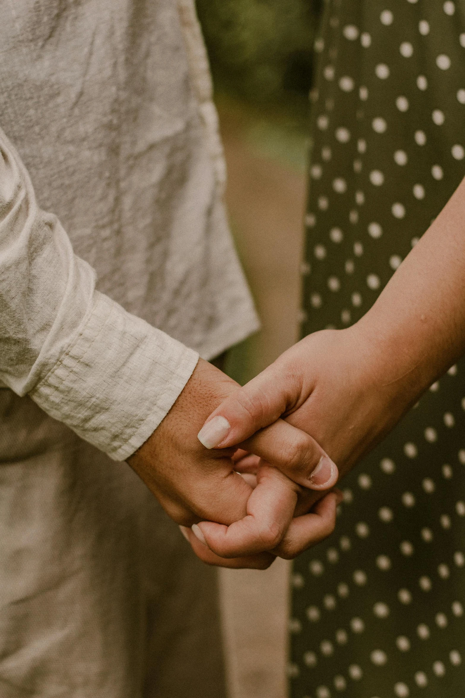 an image of two people holding hands