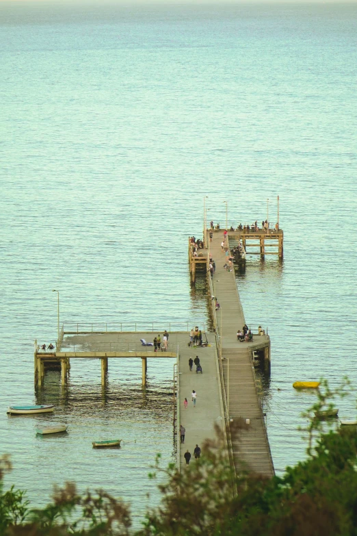 a dock and some people are at the end