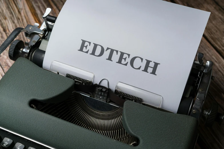 an old typewriter with the word edtech printed on it
