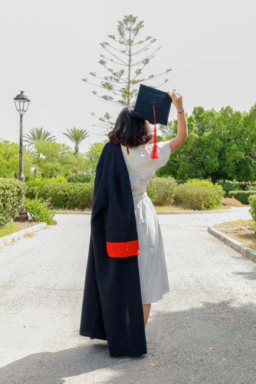 a girl with a diploma posing for the camera