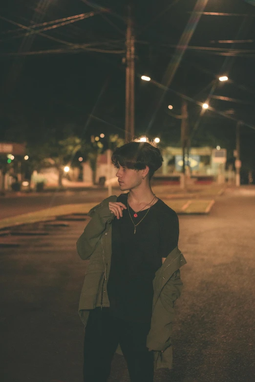 a couple standing next to each other near a parking lot