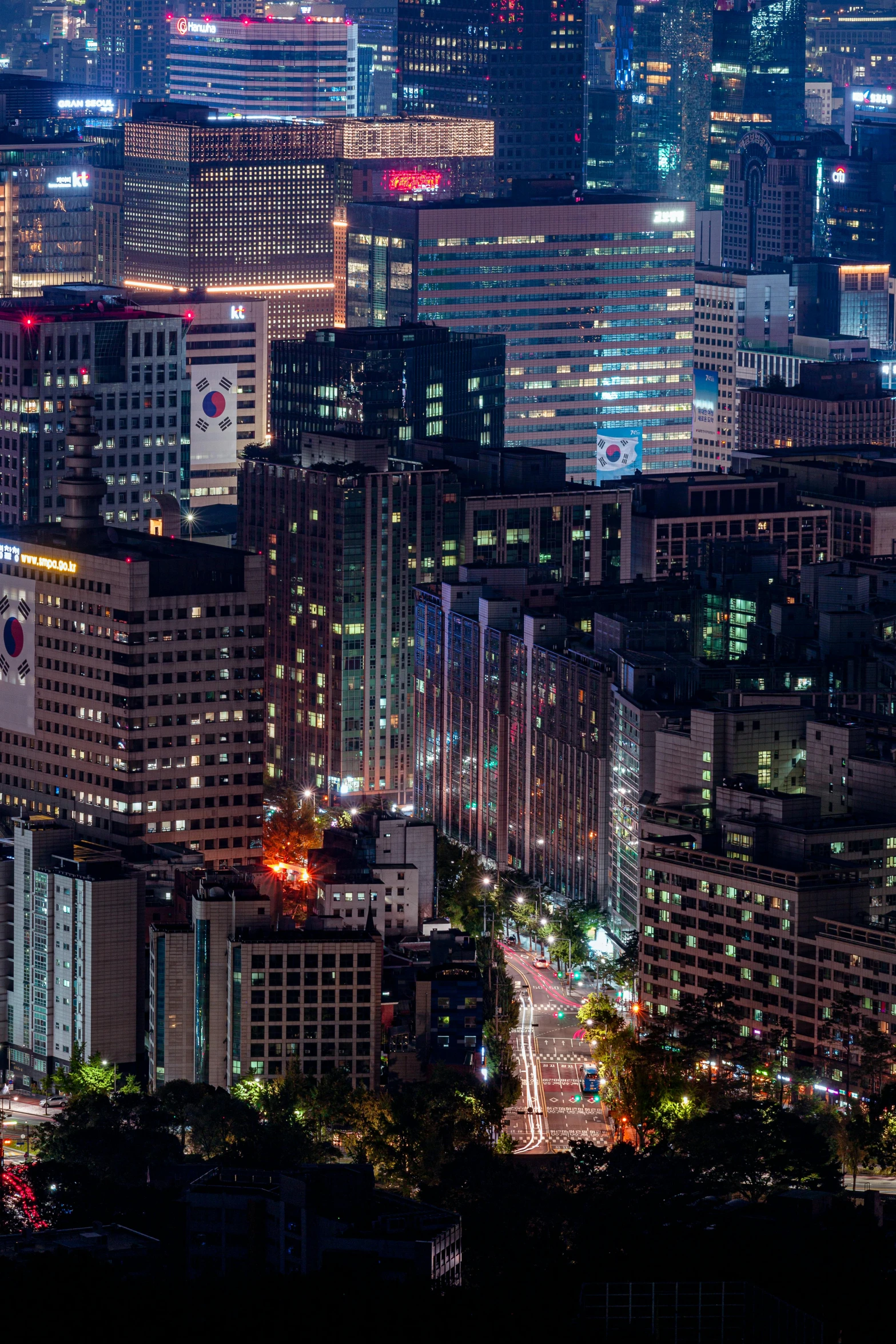 a cityscape showing skyscrs and urban buildings at night