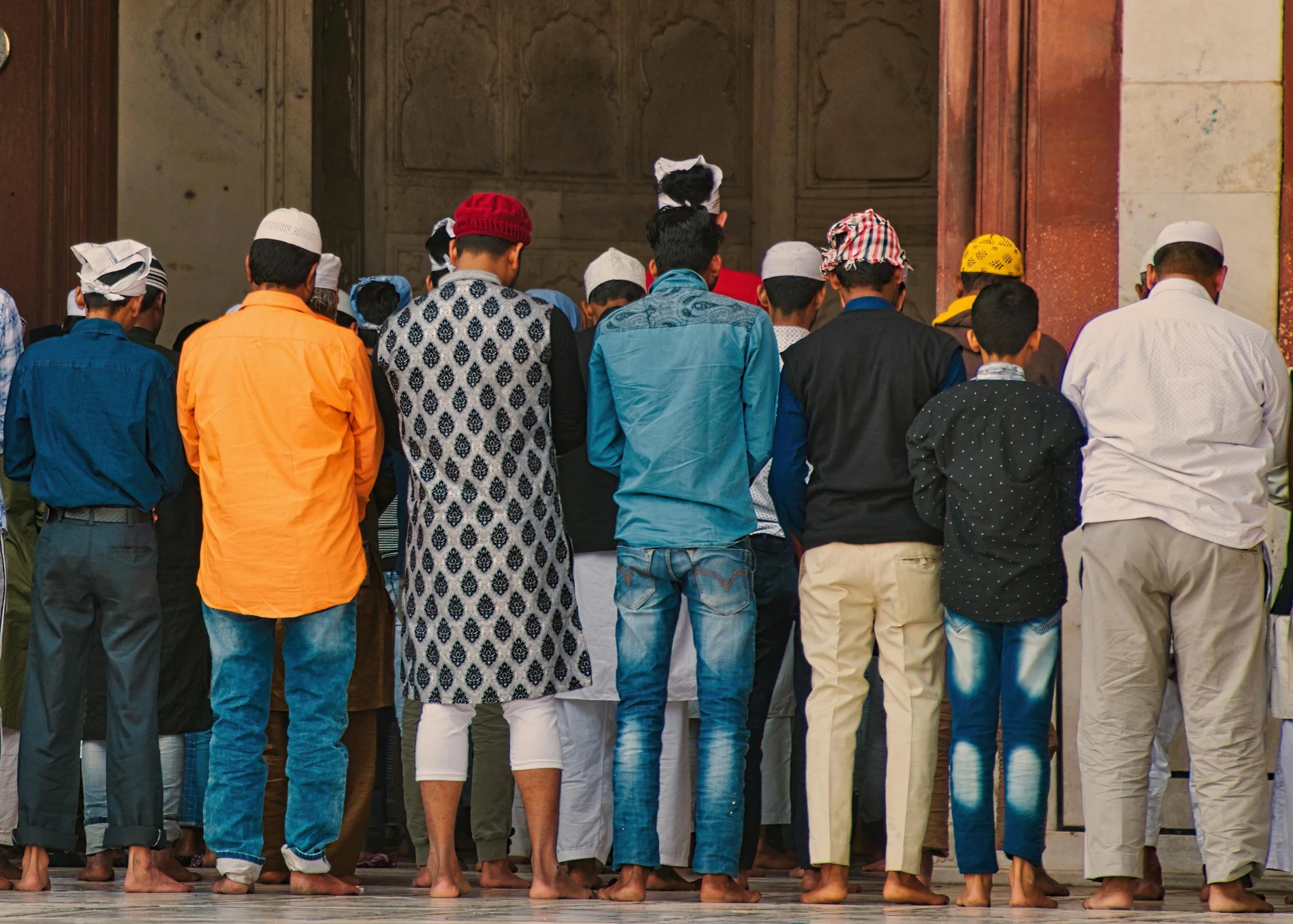 a group of people standing in front of a doorway