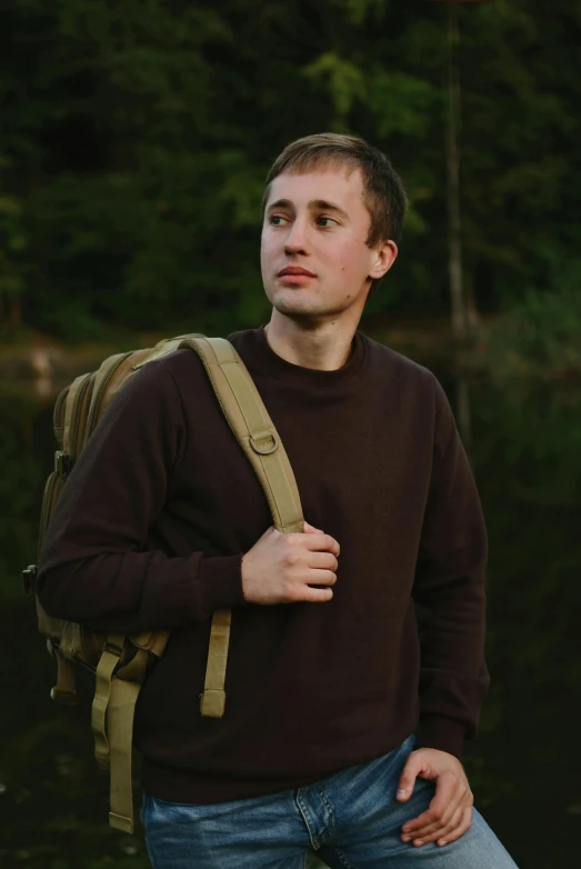 a man with a backpack leaning on his back