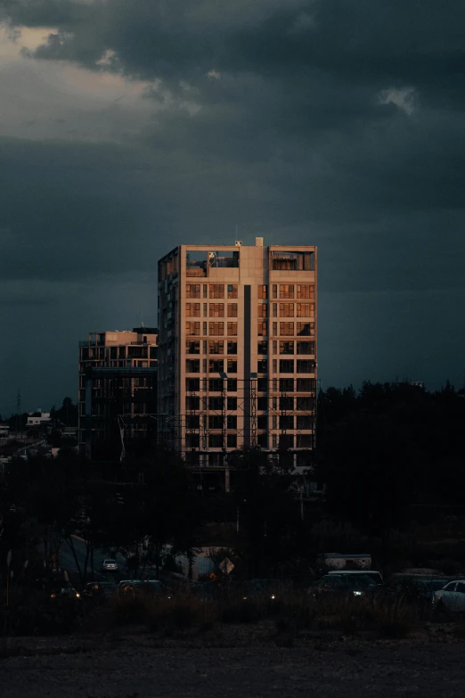 a very tall building next to a lot of buildings