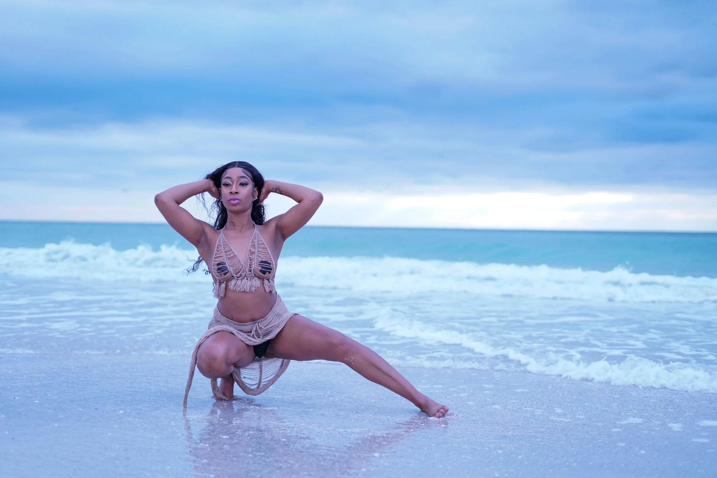 a woman that is standing in the ocean