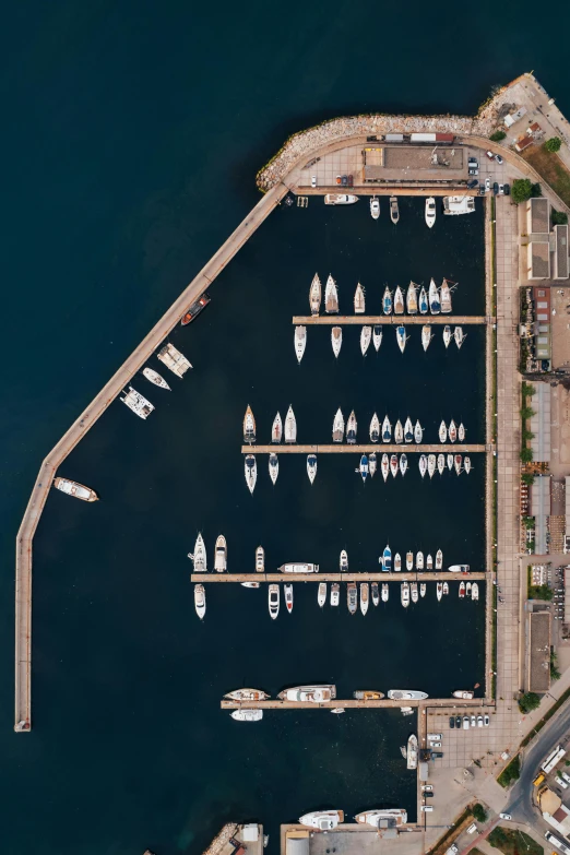 an aerial s of sail boats at the marina