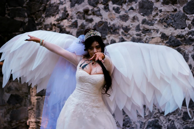 a woman with a big, feathery angel wing