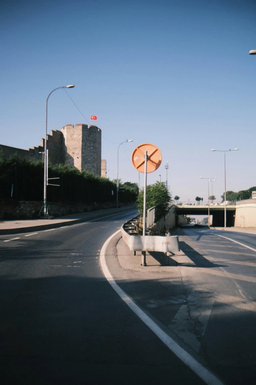 there is a sign in front of the empty street