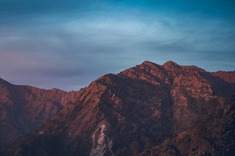 several mountains range at night in a line