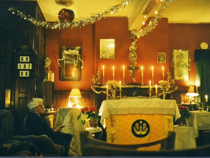 the interior of an elegant looking church with many lights