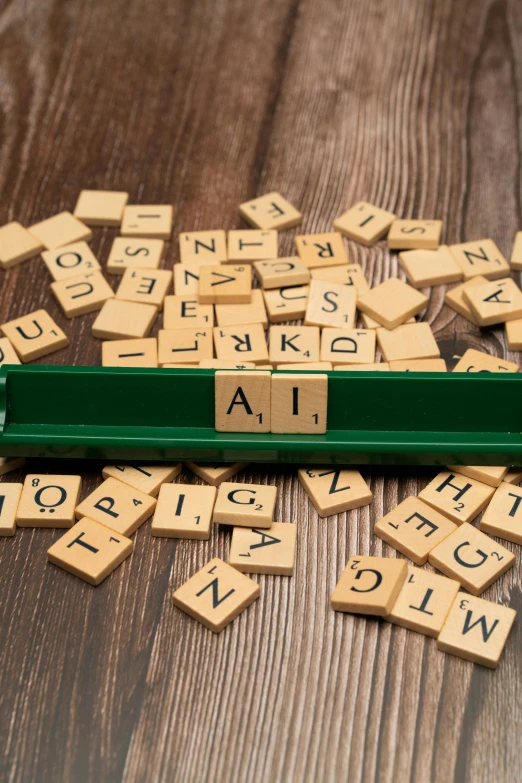 a stack of scrabble type letters that spell out the word ai