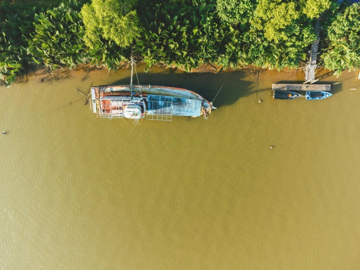 a group of boats floating next to each other near the shore