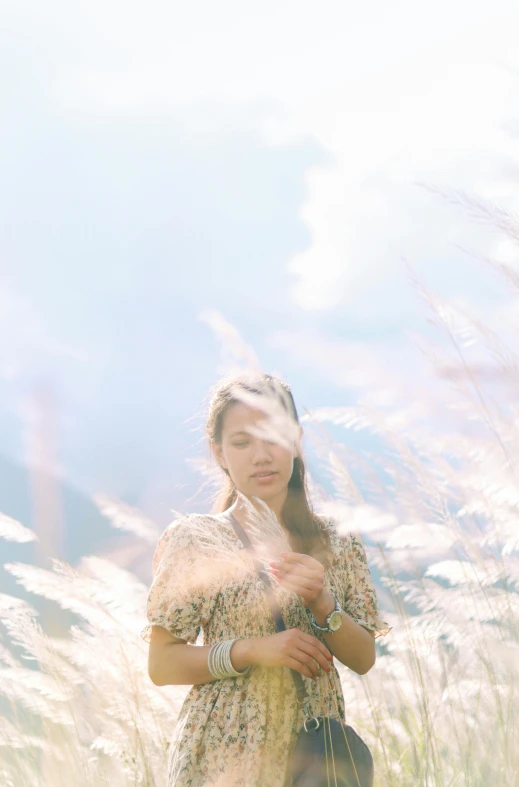 woman blowing wind in her dress on a sunny day