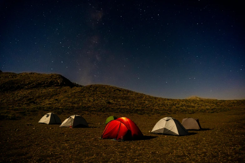 a bunch of tents are set up in a field