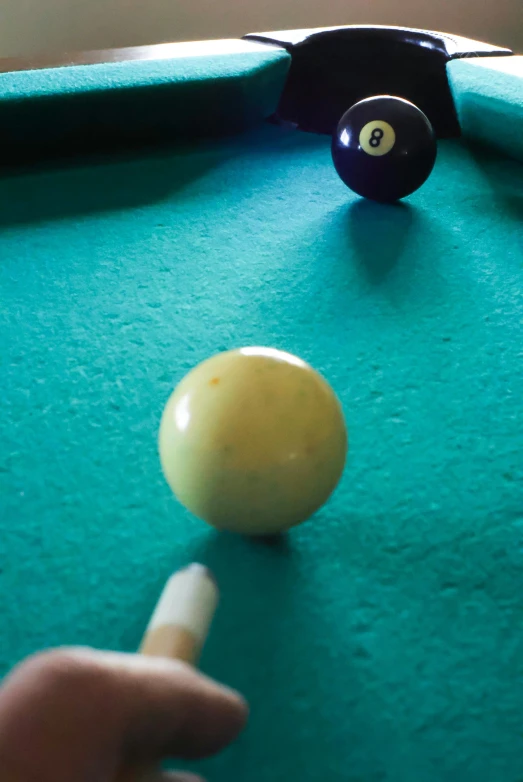 pool ball being fired to the table with cues