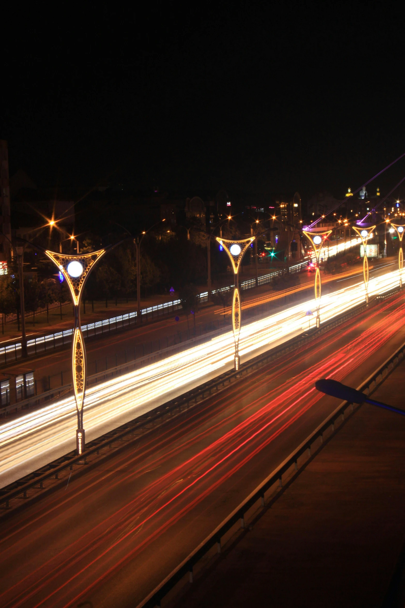 a couple of light poles are by the highway