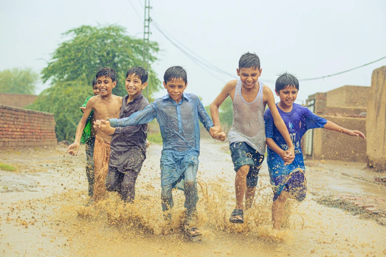 four s running through a muddy dle