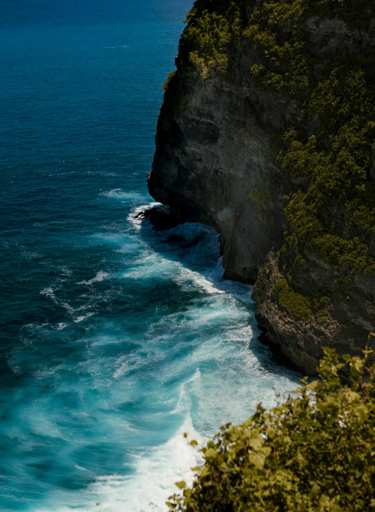 an ocean view shows waves rolling on the shore