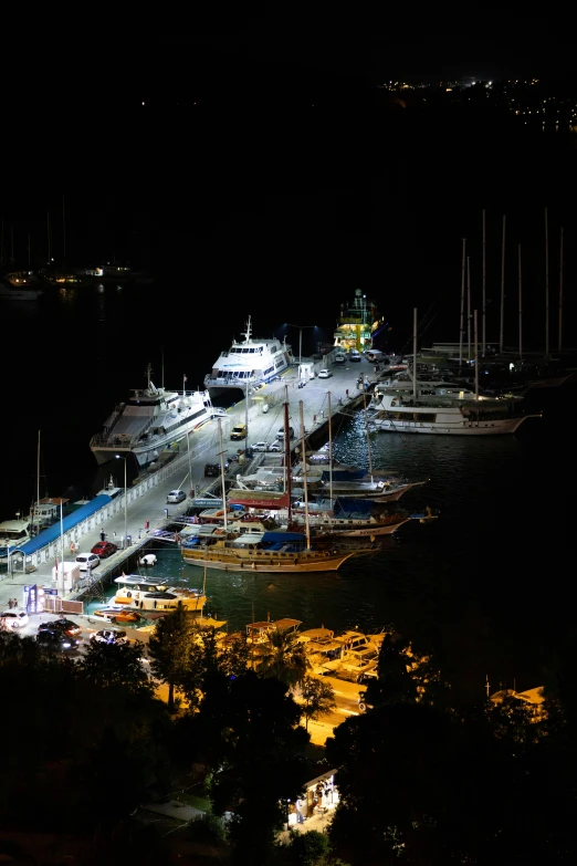 a lit up cruise ship on the water