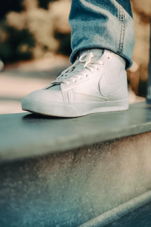 a person's feet on a ledge with their shoes off