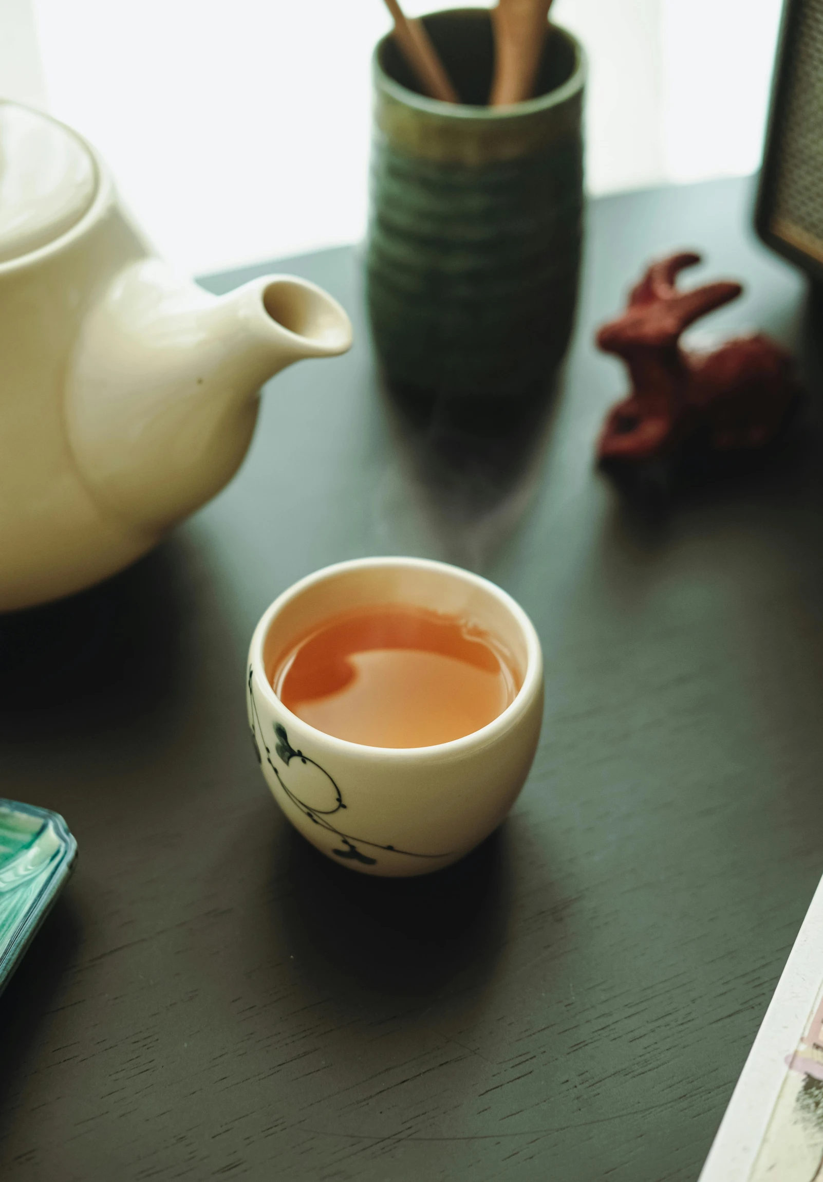 a tea cup sitting on top of a wooden table