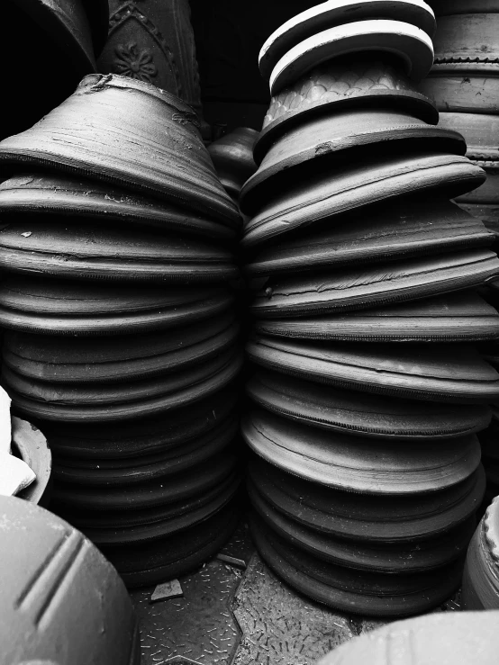 a stack of very large ceramic pots on display