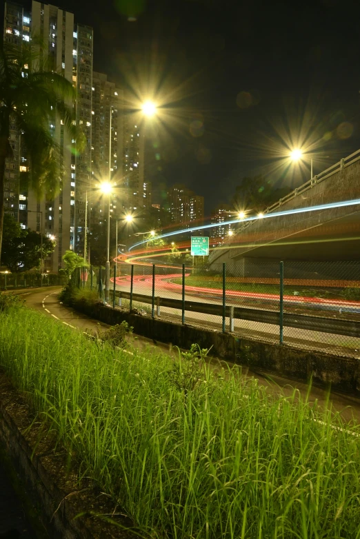 a road on a city street at night