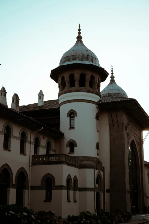 there is a tall tower next to the clock tower